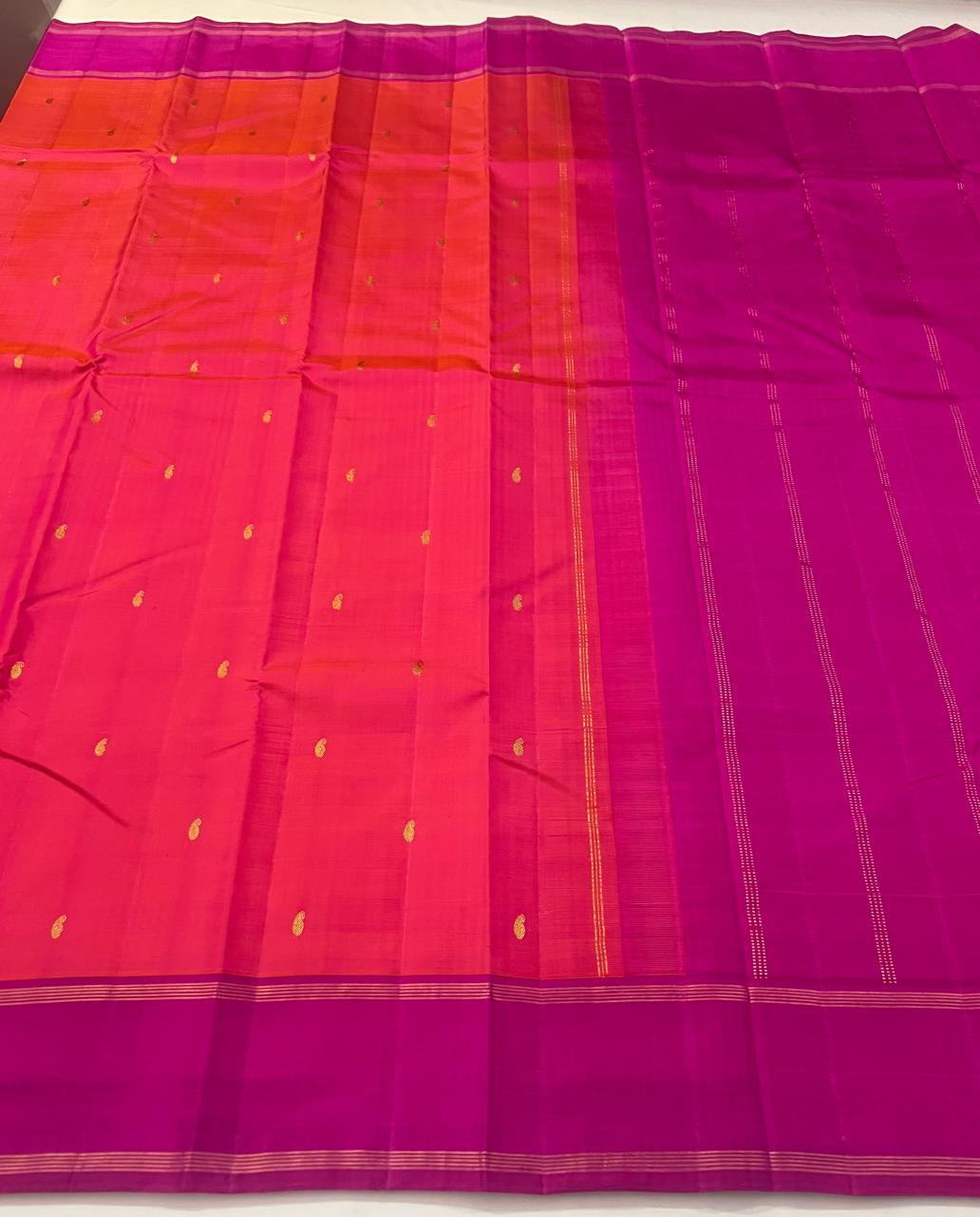 Orange Kanchipuram Silk Saree with a Contrast Pink Zari Border